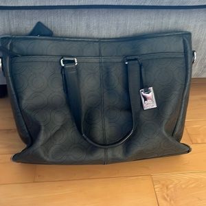 Coach brief case/ purse for work school or any occasion.